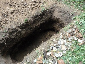 The trench cut in at right angles towards the middle of the pit (bottom left).
