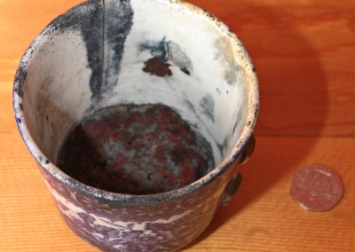 Cup containing red lead paint